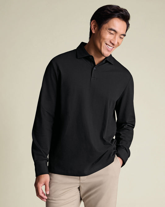 https://www.charlestyrwhitt.com/dw/image/v2/AAWJ_PRD/on/demandware.static/-/Sites-ctshirts-master/default/dwd85fbfa5/hi-res/JEP0453BLK_MODEL_UNTUCKED.jpg